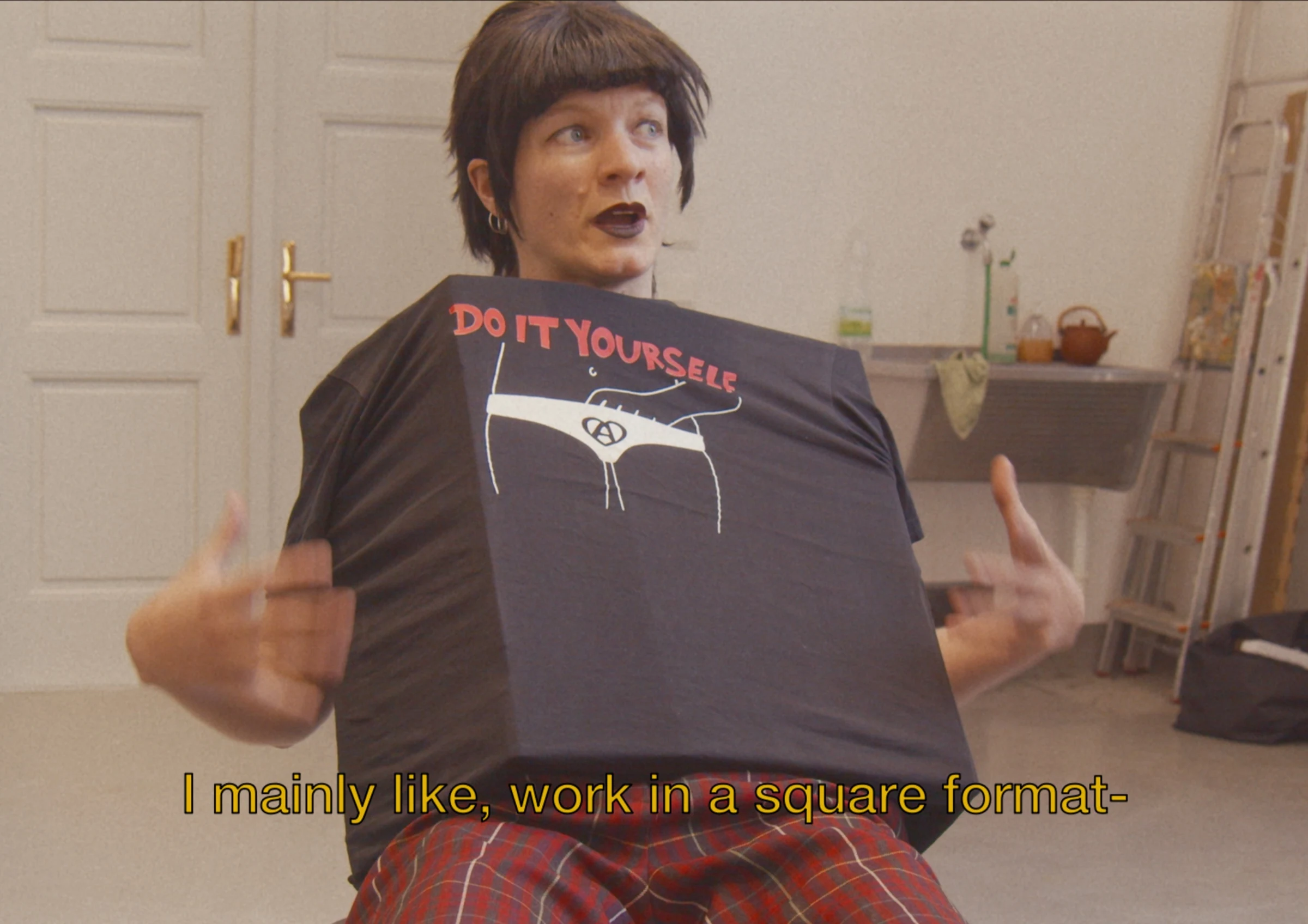 A character wearing a handmade Do It Yourself shirt.