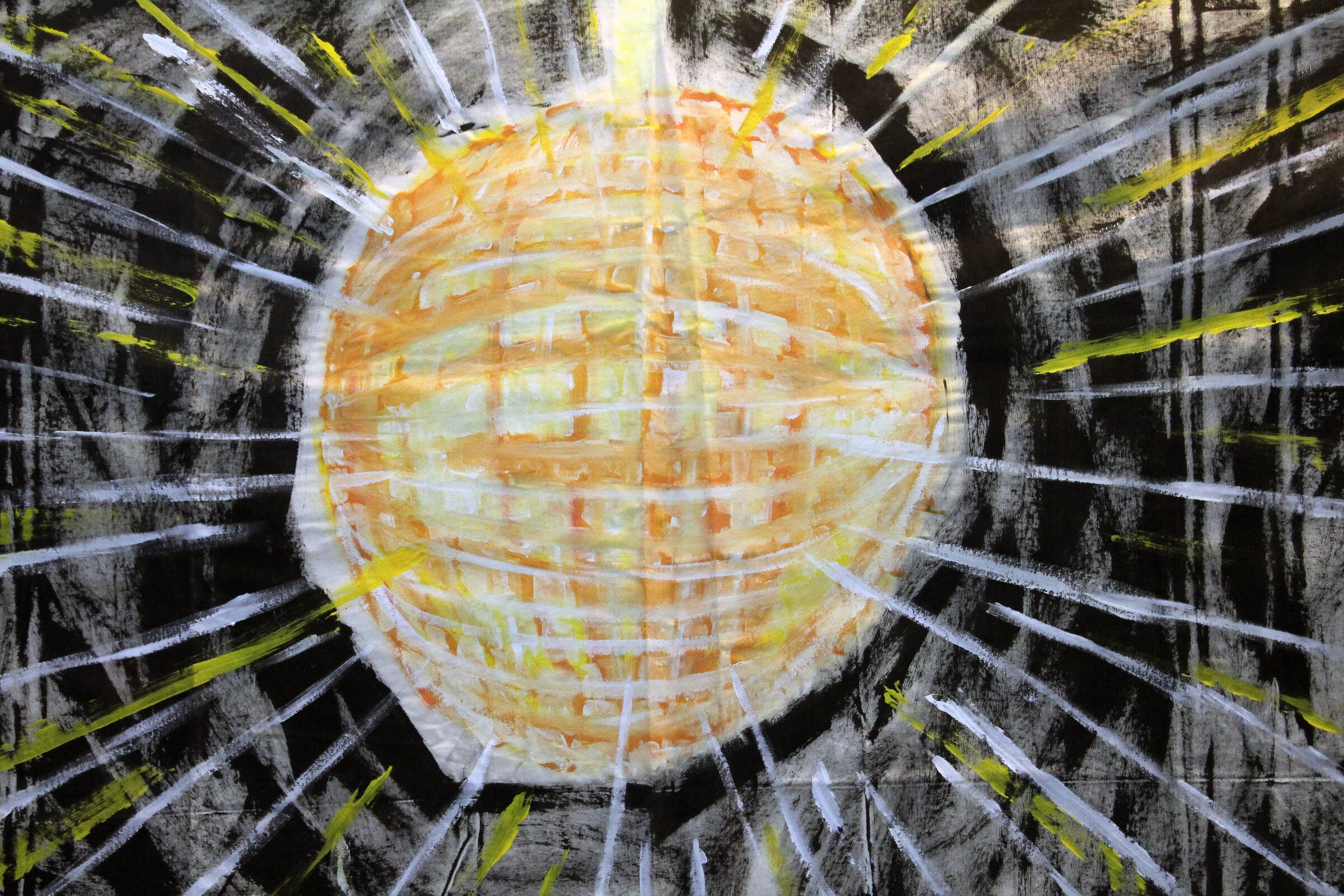 A close-up of the yellow disco ball and radiating white and yellow lines on black canvas.