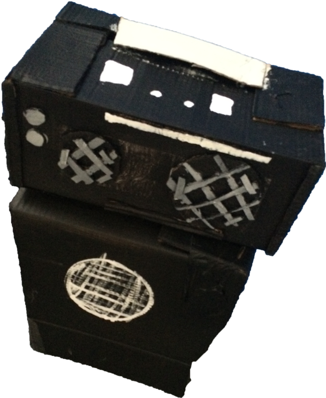 A handmade black cardboard stereo and speaker.