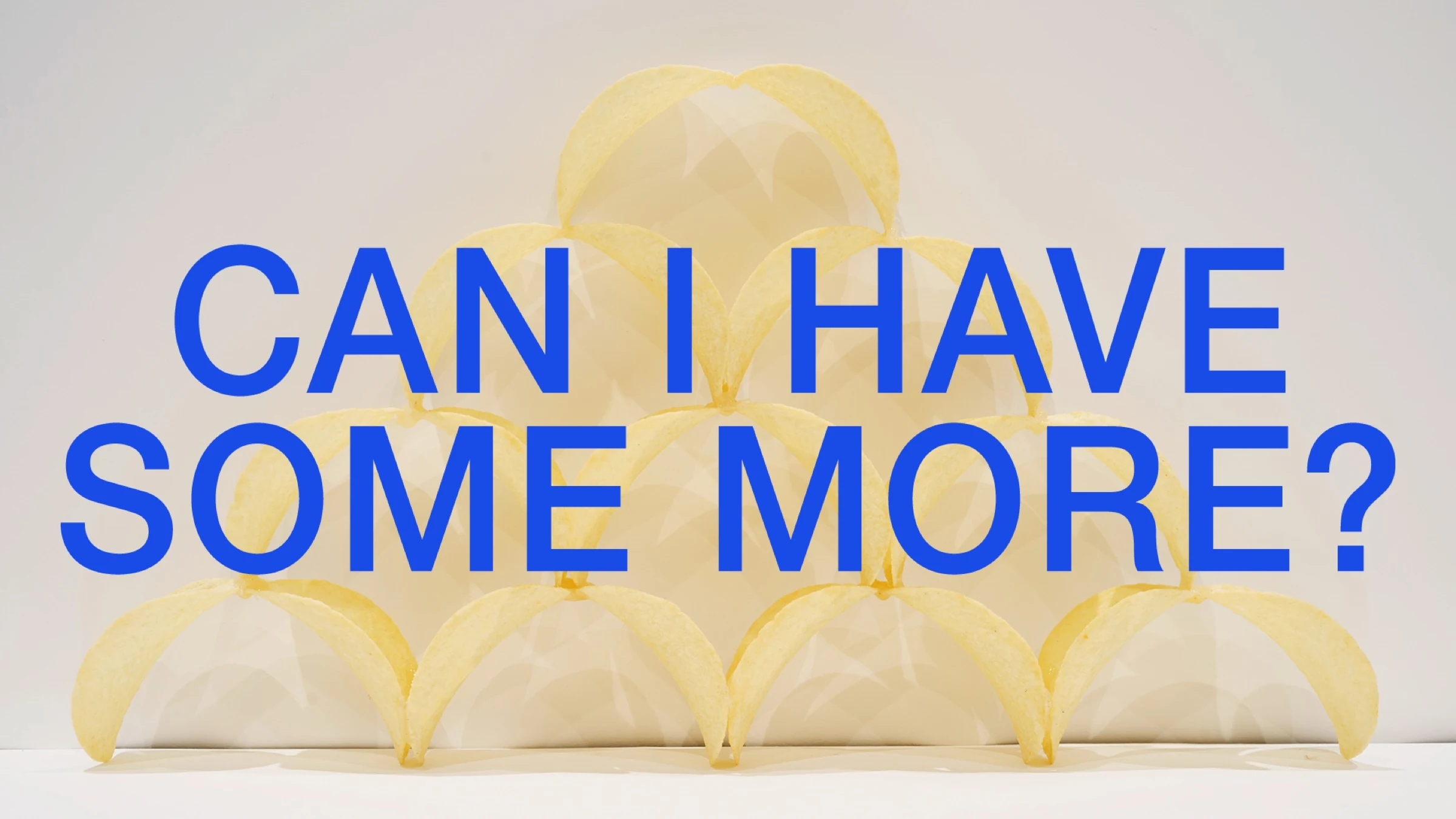 Can I Have Some More? title page with blue lettering over a pyramid of crisps.