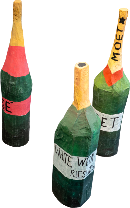 Three handmade cardboard wine bottles.