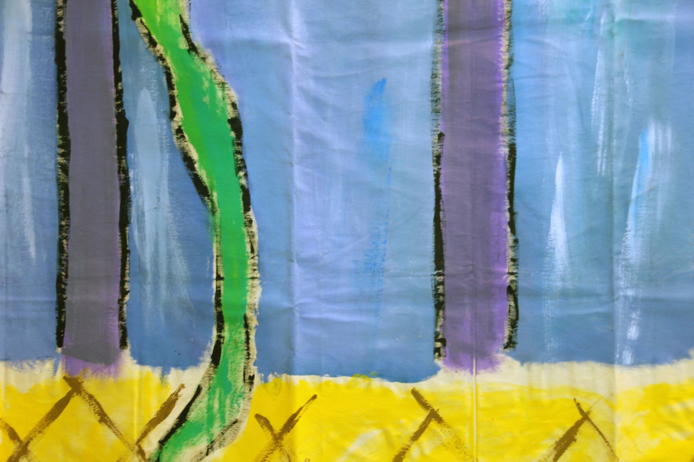 A detail of a blue backdrop with purple vertical stripes, green curved shapes and a yellow diamond-patterned floor.