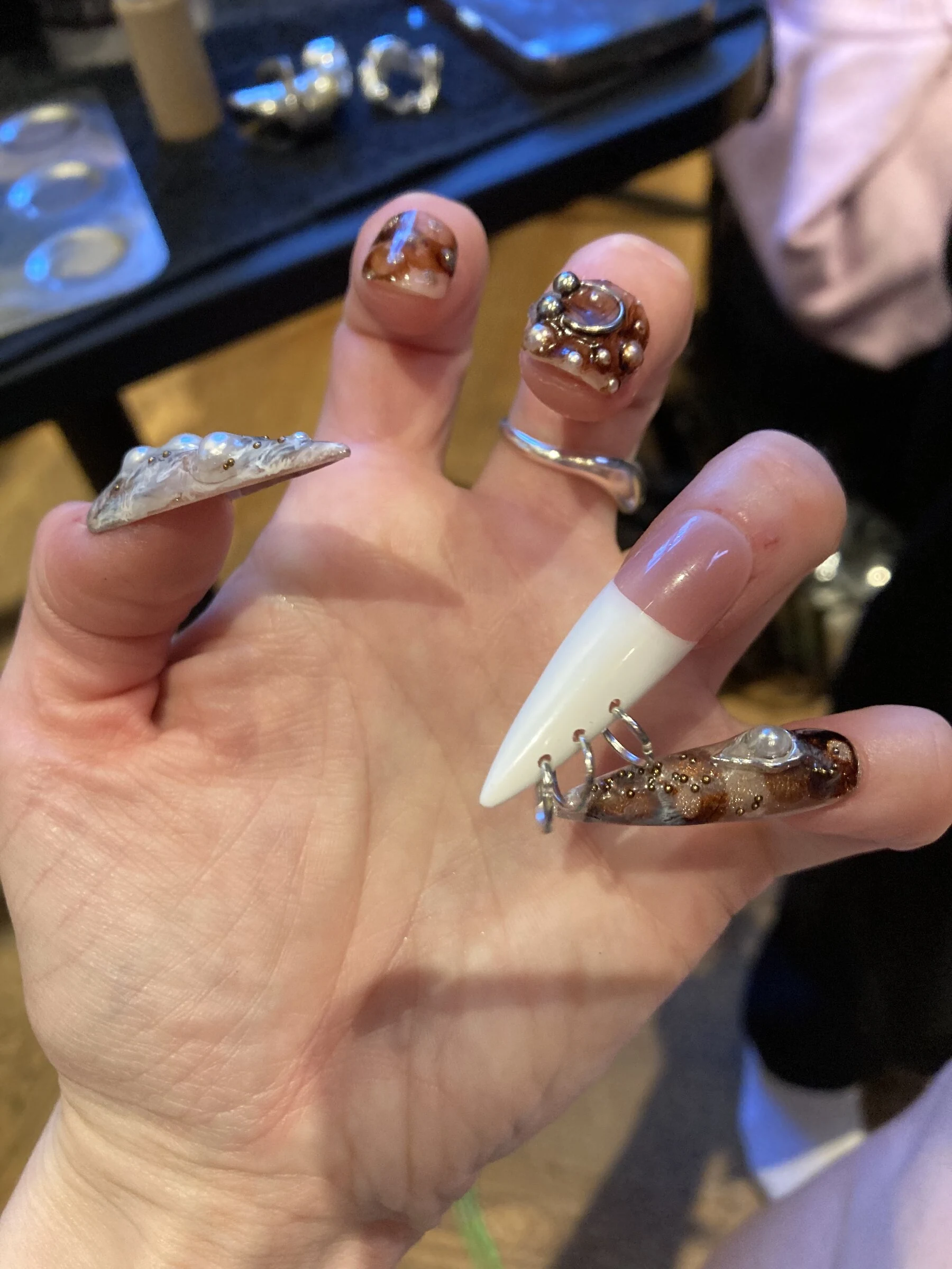 A close-up of decorated nails during preparation for the Tanzquartier photo shoot.