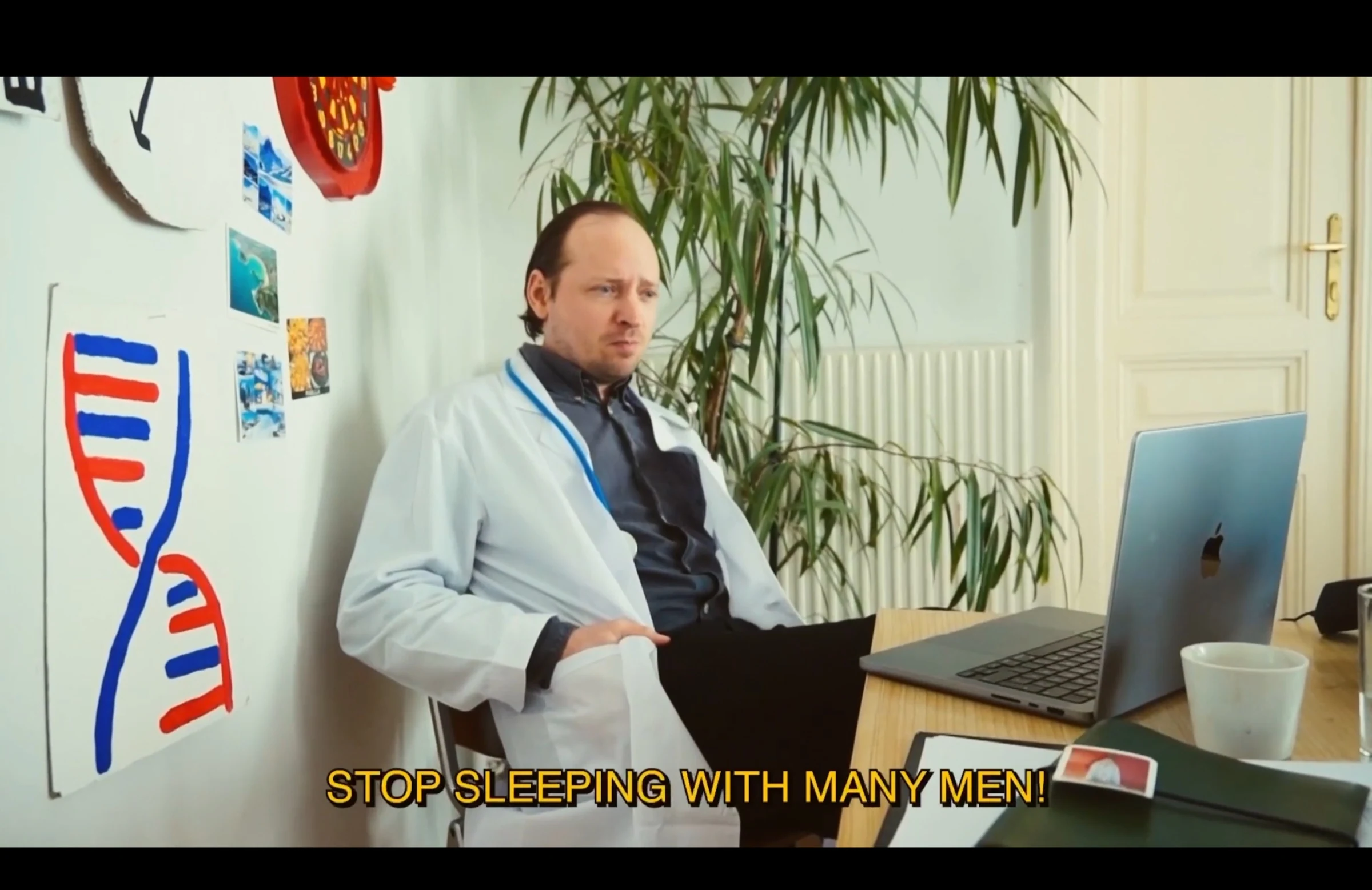 A character in a white doctor's coat sitting beside a laptop and a painted DNA diagram, with the subtitle Stop sleeping with many men!