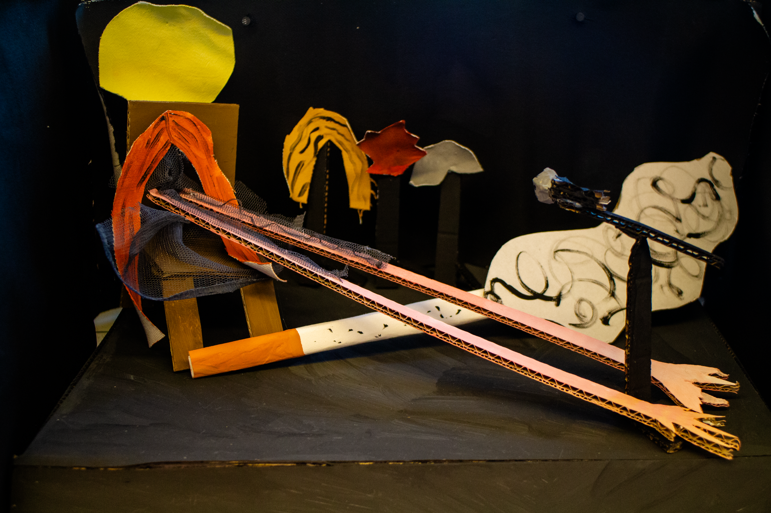 Handmade cardboard figures and props from The Gash Club against a dark backdrop.